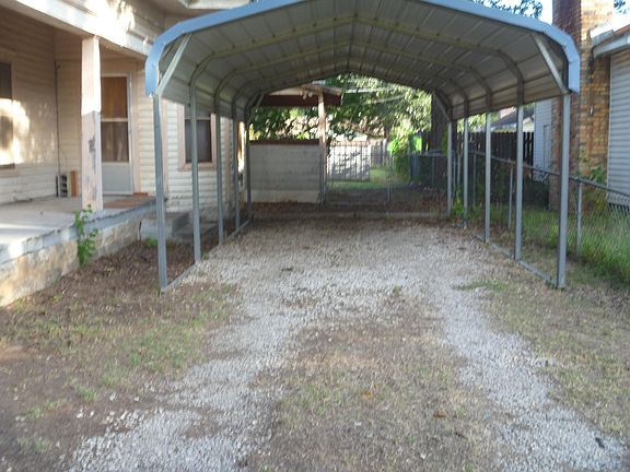 Carport side door and entrance to back yard