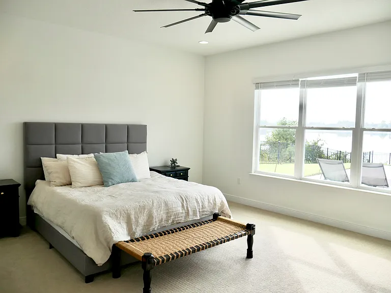 Primary bedroom with view of the lake