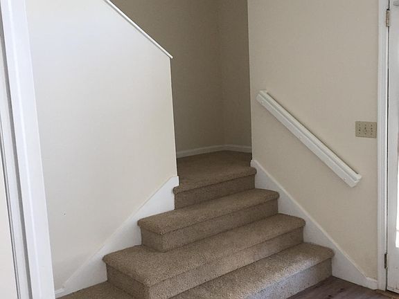 Entryway and stairs to second and third levels