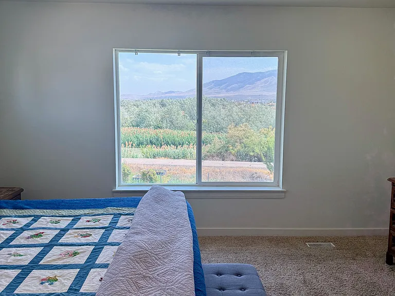 Master bedroom with river and mountain views.