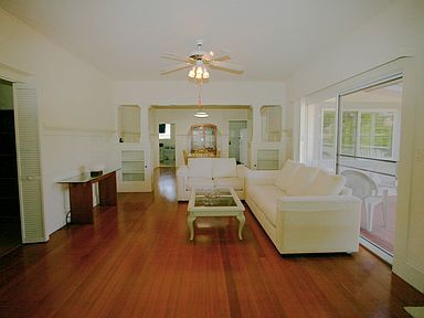 Living area with dining room in background