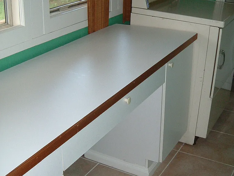 Work Bench in Utility Room. And Washer / Dryer.