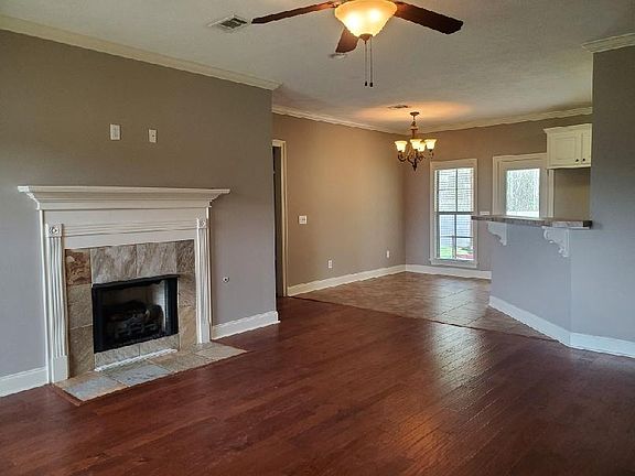 Family Room w/hardwood floors. Fireplace w/gas logs. View of the Kitchen area