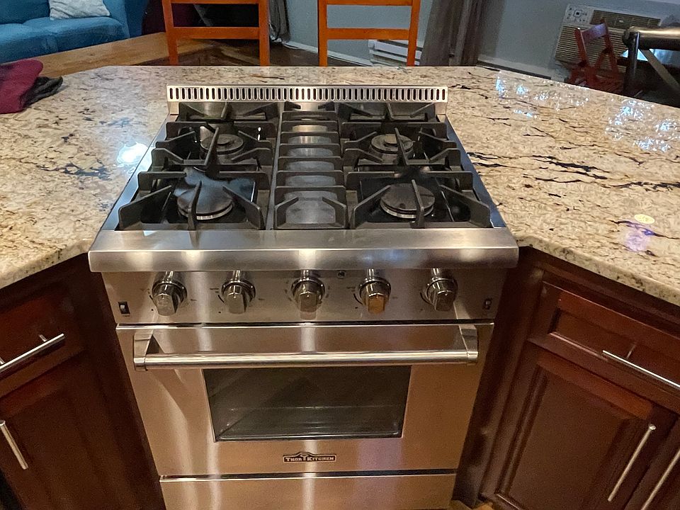 Chef's stove facing out to living room.