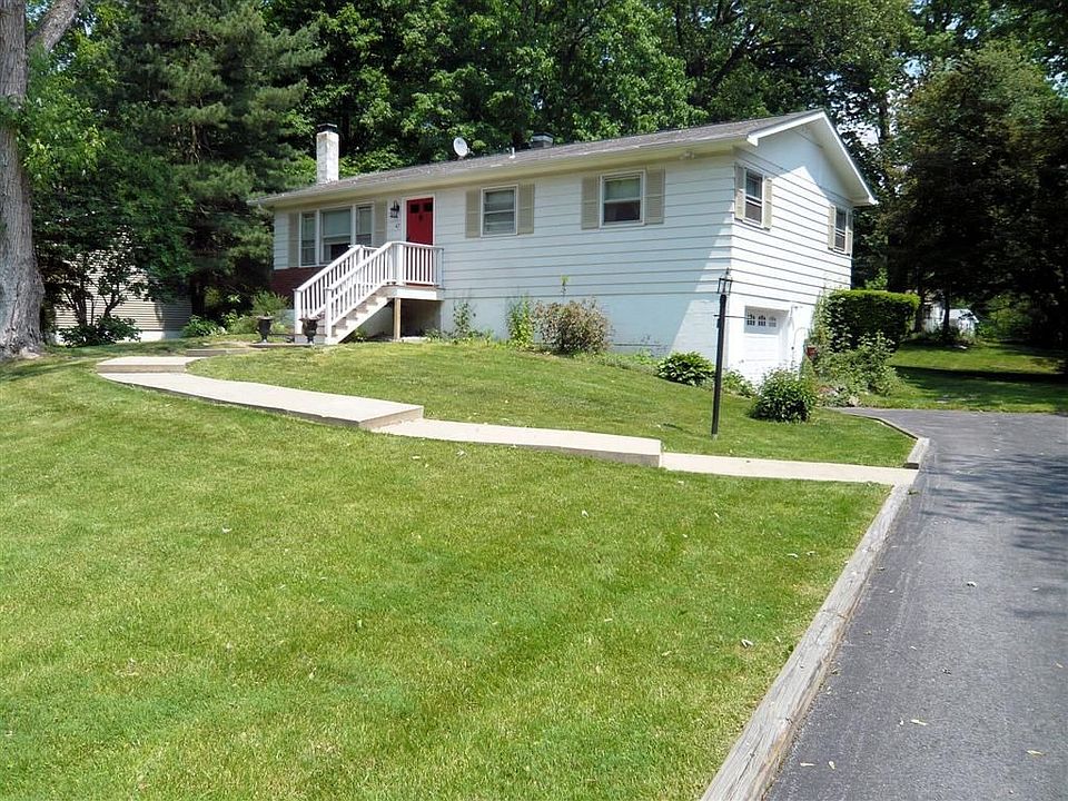 Front of Home, Note Stylish Concrete Walkway to Cedar & Solid Mahogany Front