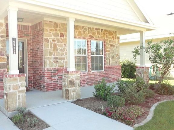 Enjoy morning coffee on west facing front porch.