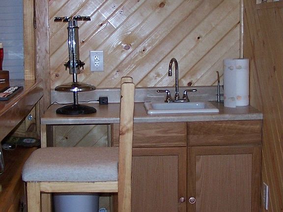 Wet bar in custom basement provides a great place to party.