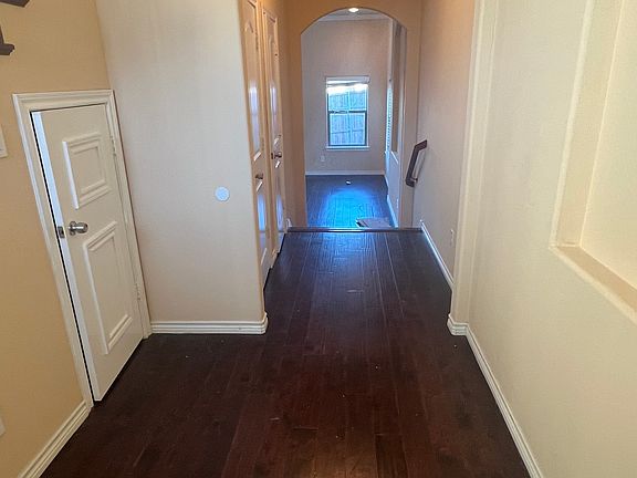 front foyer area with 1 storage closet and 1 coat closet and 1 full bathroom in the hallway