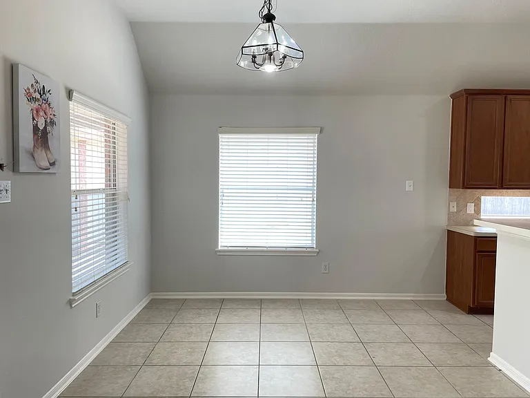 Sunny breakfast area conveniently located next to the kitchen with backyard views.