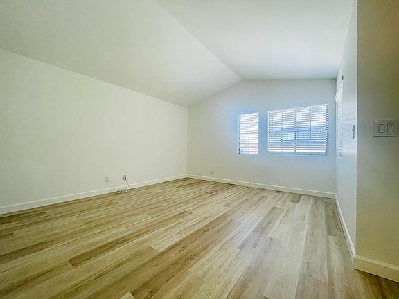 Light and Bright Family Room with New Luxury Vinyl Plank Flooring and Fresh Paint throughout.