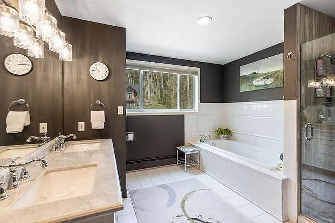 Ensuite bathroom for second floor primary with tub and separate, walk in shower