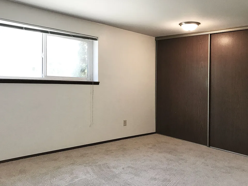 Large comfortable bedroom with full wall closets