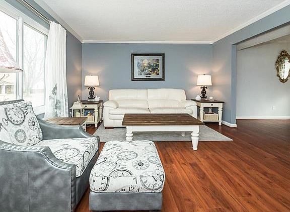 Lovely living room with newer laminate flooring.