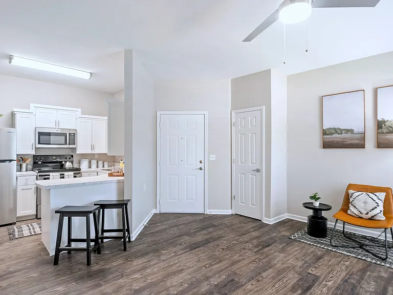 Embrace seamless living in our open floor plan, featuring a modern ceiling fan and contemporary design.