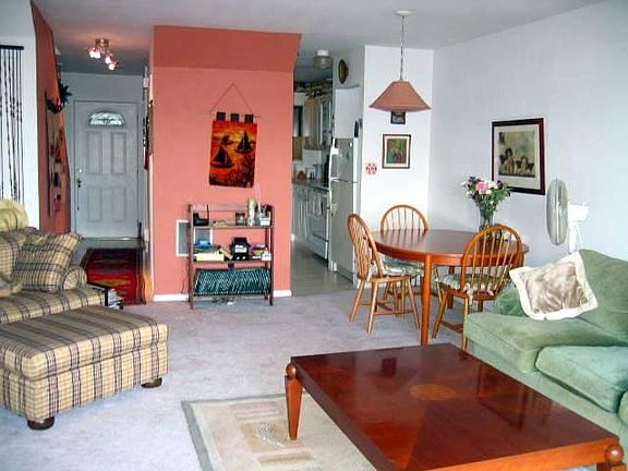 View from livingroom to dining area/kitchen/foyer