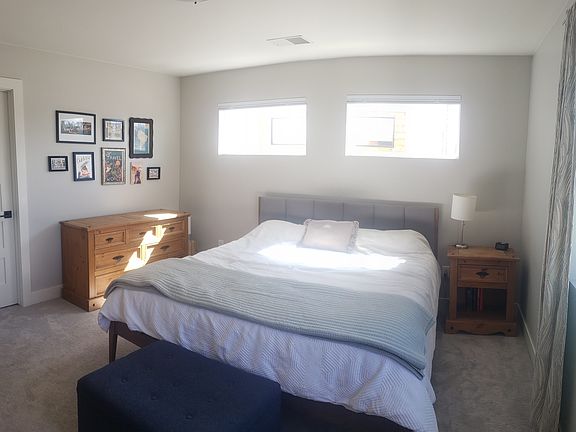 large master bedroom with huge walk-in closet and ensuite large bathroom with two sinks and a shower