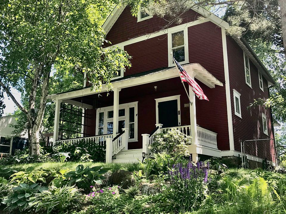 The front of the home in full bloom summer.