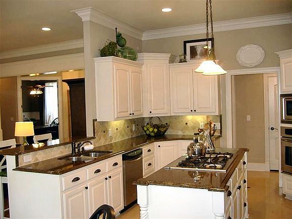 Beautiful gourmet kitchen with granite counters, island with gas stovetop
