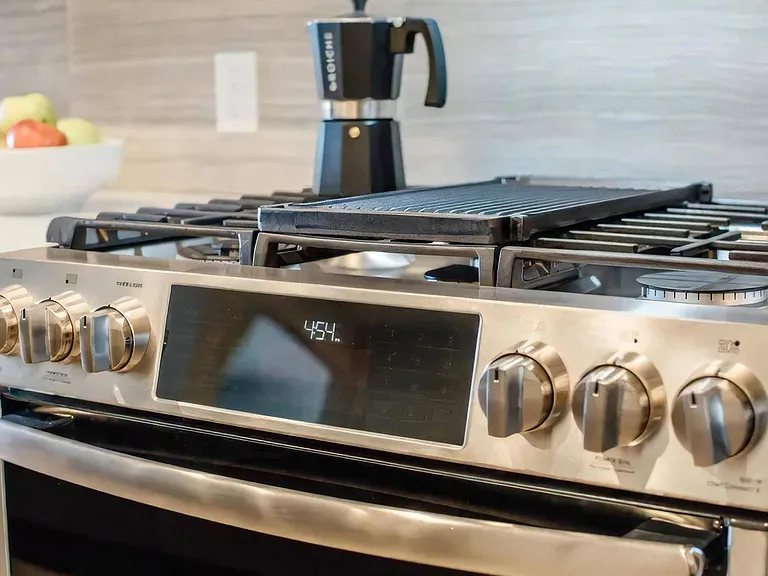 Fully-Equipped Kitchen Featuring Modern Stainless Steel Appliances