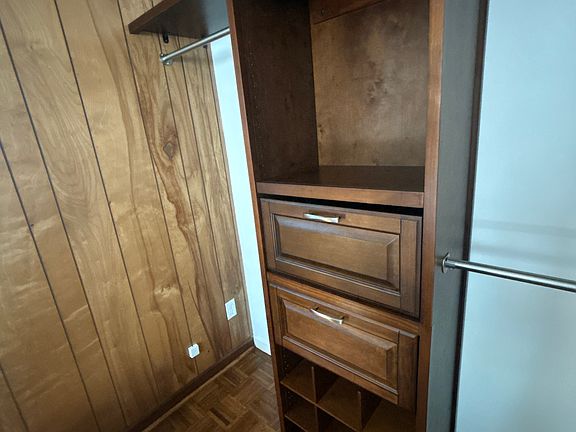 Built in closet with drawers/shelf and cabinets for a shoe keeper