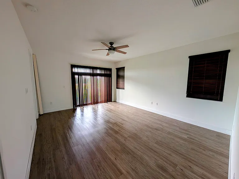 Master bedroom
-Motorized built-in blackout curtains leading to mini balcony over back yard
-Two windows features built-in manual blackout curtains
-Impact door/window to balcony
-Ceiling fan