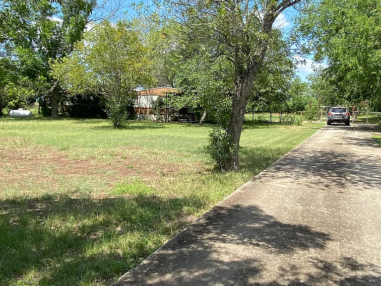 This is a view of the front yard and the home from the street.