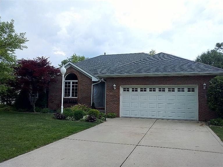 Brick & vinyl ranch with finished lower level walk-out.