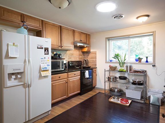 Electric range. Solatube floods kitchen with natural light.