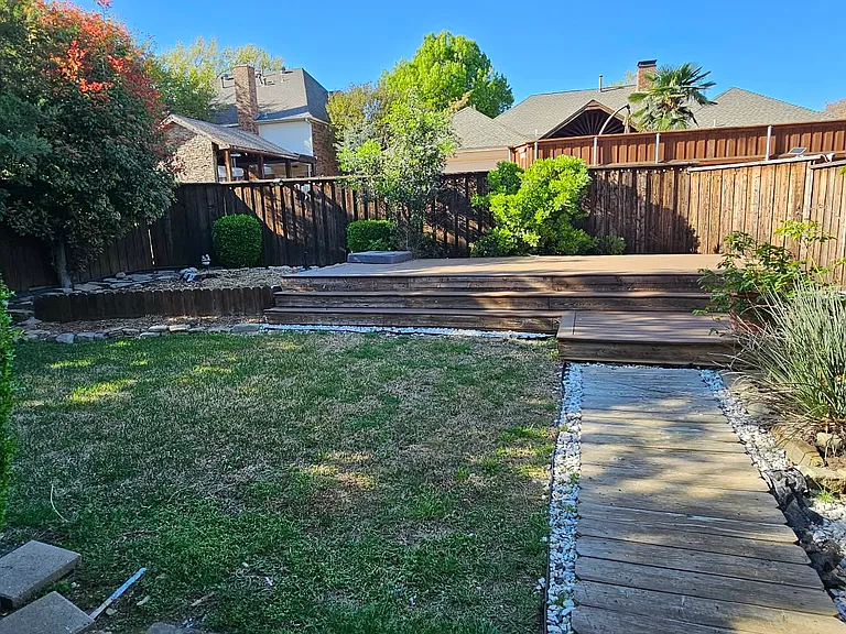 Private backyard has a deck and a covered patio