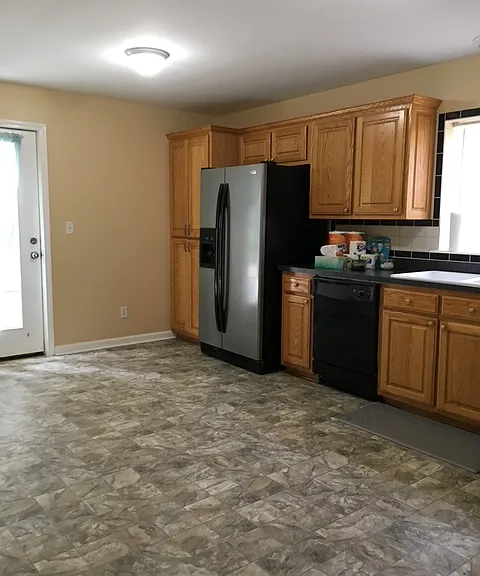 Kitchen with side entrance and small landing deck