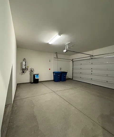 2 car Garage w/tankless water heater & whole house soft water system - cubby space for storage & keyless entry