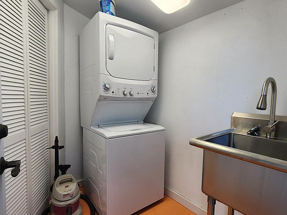 Laundry room attached to the apartment.