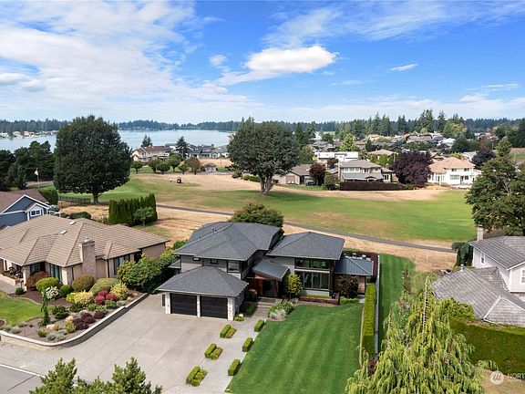 Enjoy all day sun in your yard and watch the golfers from your covered outdoor living, back deck or patio>