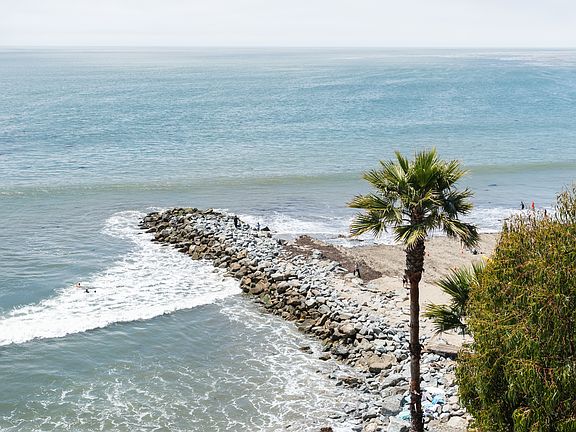 Breathtaking oceanfront views just steps from the sand_watch surfers, sunsets, and the soothing waves from the comfort of your coastal retreat.
