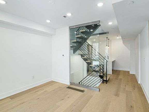 Attention to detail with glass stairwell.