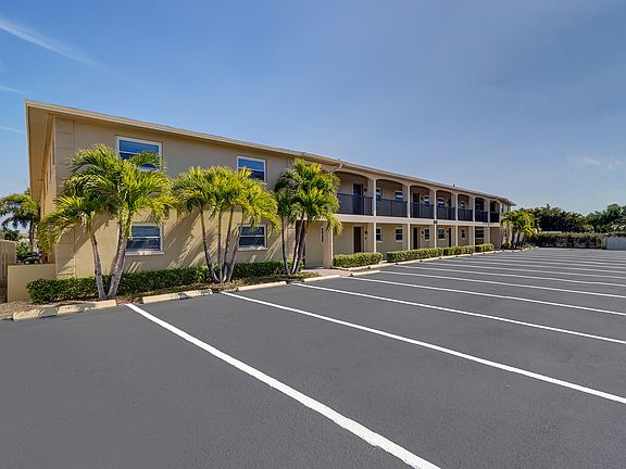 The corner parking space is for unit 101