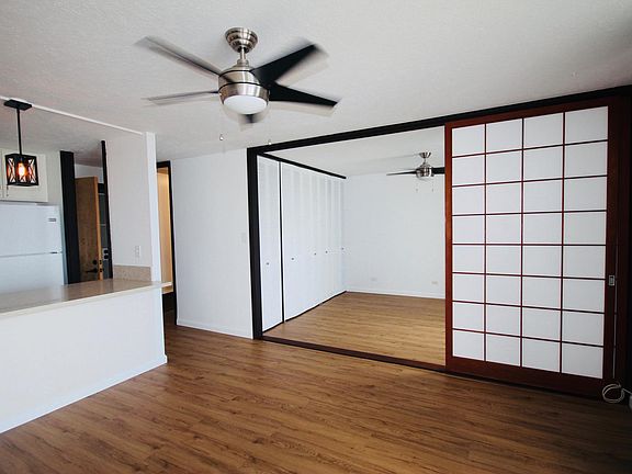 Shoji-style room divider separates living room from bedroom.