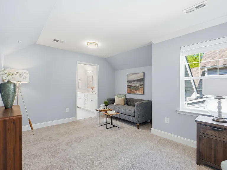 Master bedroom with sitting area, massive walk-in closet, and custom spa-like en-suite with soaking tub.