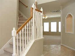 beautiful stairway w/ travertine entry