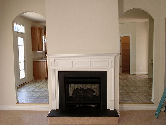 Fire place in living room to Kitchen