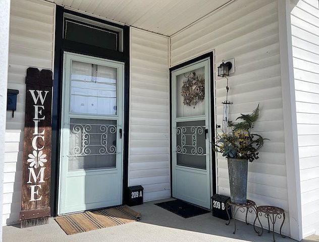 Left side door is entrance to unit 209-A. Right side door is entrance to duplex unit B.