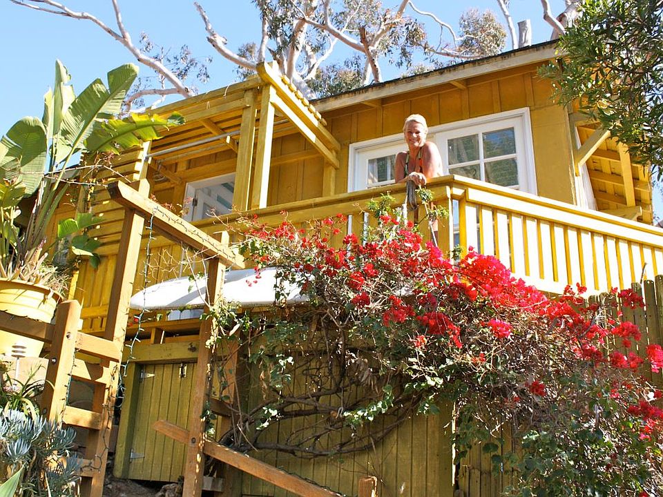 Photo of cottage from stairs to the beach below.