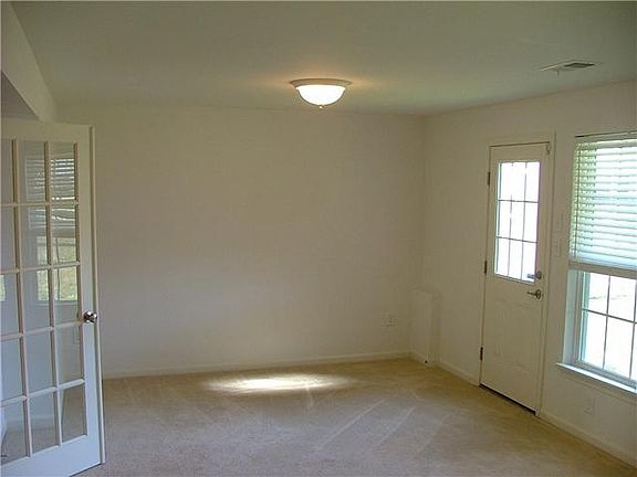 Family Room in Lower Level w/ Door to Backyard