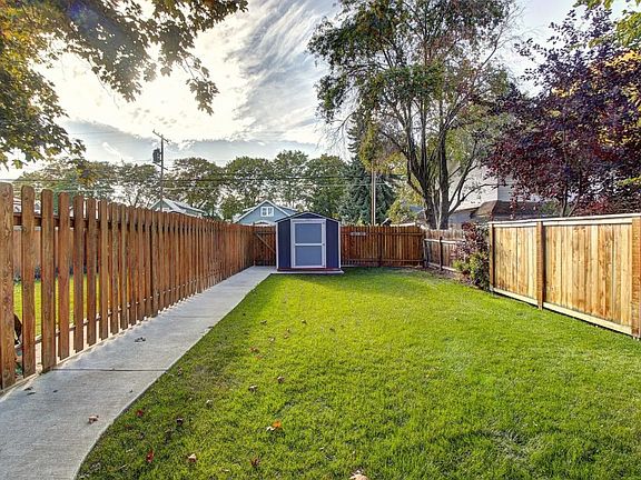 Gate to the left of the shed leads to 2 space parking.