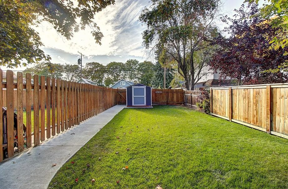 Gate to the left of the shed leads to 2 space parking.