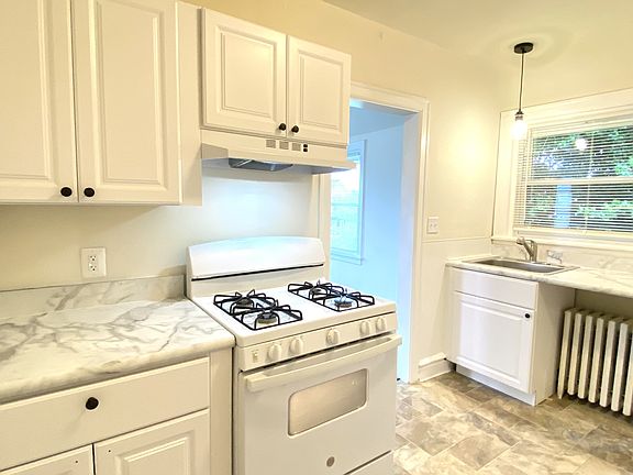 Updated Kitchen with New Cabinets, New Countertops and New Lighting