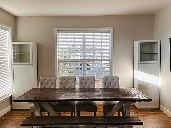 Large dining room table and storage cabinets may stay if desired