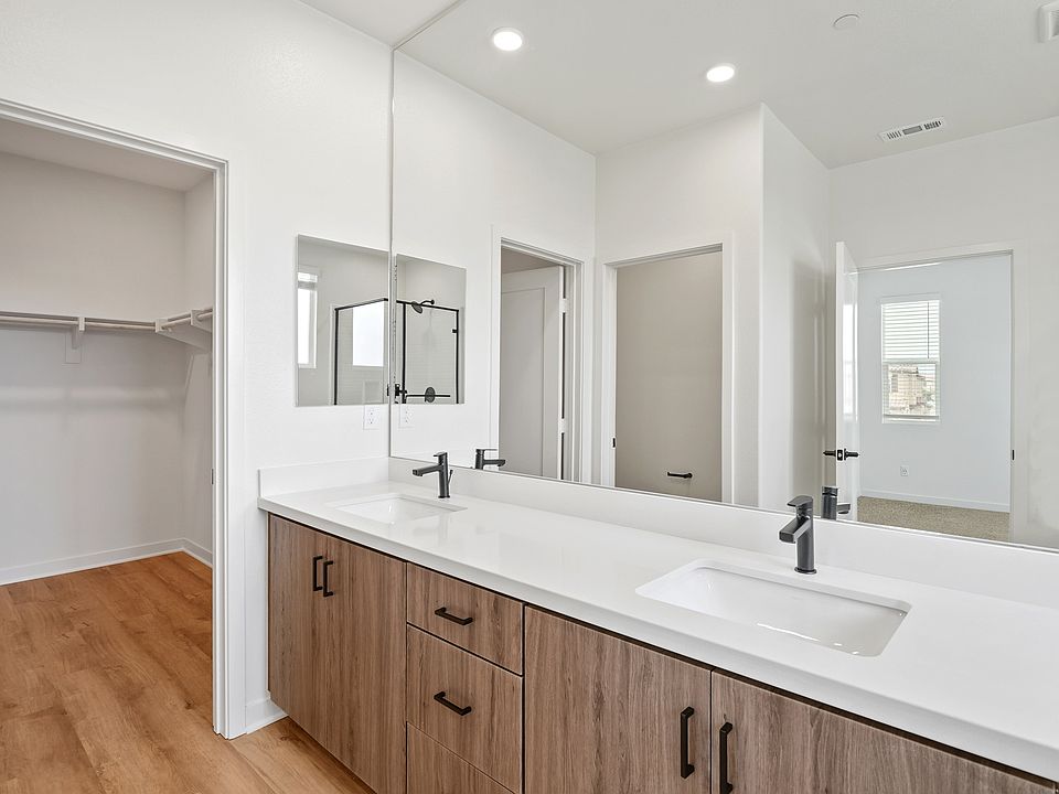 Dual sink ensuite and large walk-in closets in select homes.