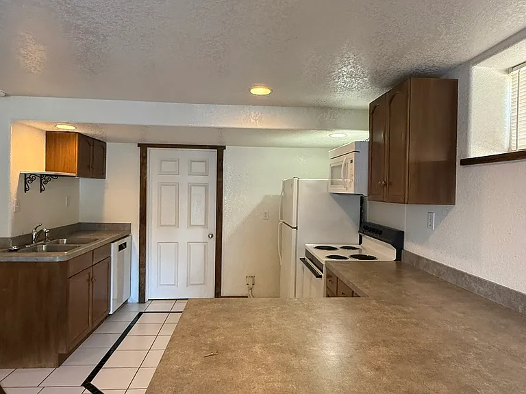 Spacious kitchen with bar seating