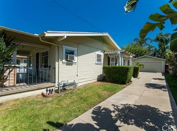 Side of house, side porch, 2-car garage